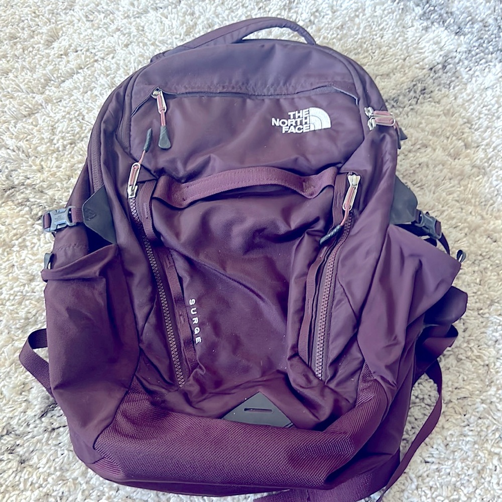 Burgundy North Face Women’s Surge Backpack with Laptop compartment.